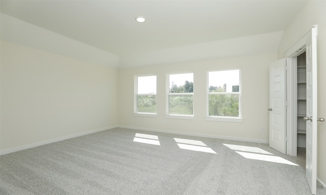 spare room featuring light colored carpet