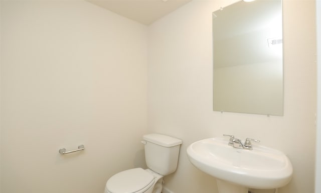 bathroom with sink and toilet