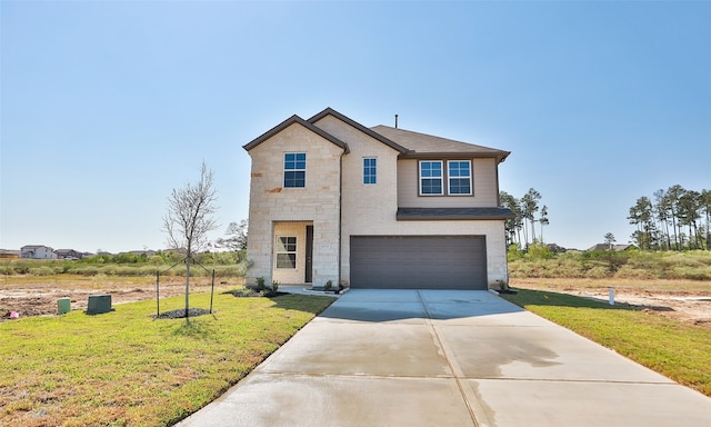 view of front facade featuring a garage and a front lawn