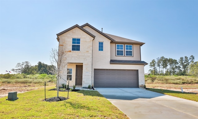 view of front of house featuring a front yard and a garage