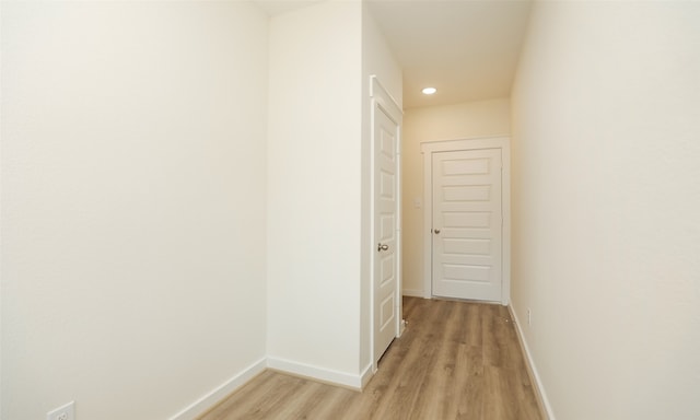 corridor featuring light hardwood / wood-style flooring