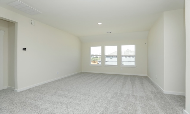 spare room with light colored carpet