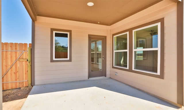 entrance to property featuring a patio area