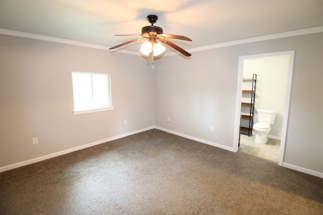 carpeted empty room featuring ceiling fan and ornamental molding