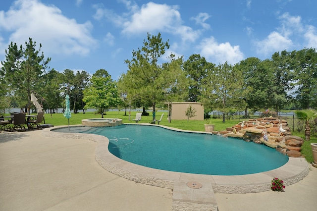 view of pool featuring a patio area, an in ground hot tub, and a lawn