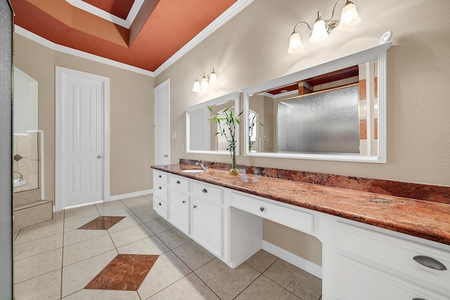 bathroom featuring ornamental molding, tile flooring, and vanity