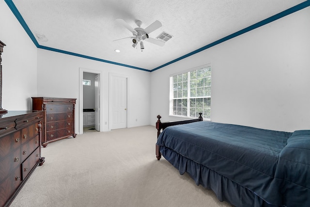 bedroom with light colored carpet, a textured ceiling, ceiling fan, and crown molding