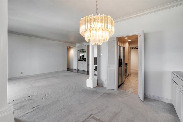 unfurnished dining area featuring crown molding, light colored carpet, and a chandelier