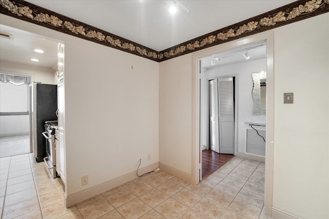 corridor with light tile patterned flooring