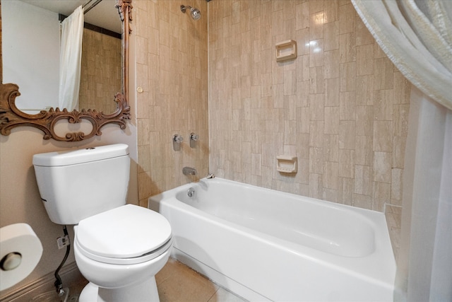 bathroom with shower / bath combination with curtain, tile patterned floors, and toilet