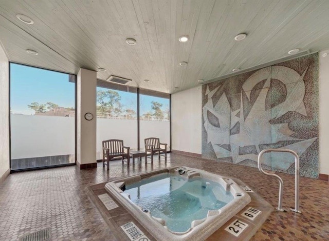 interior space featuring wood ceiling and a jacuzzi