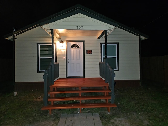 view of exterior entry at night