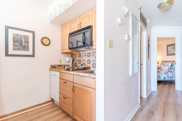 kitchen with light brown cabinetry, tasteful backsplash, light wood-type flooring, ornamental molding, and white dishwasher