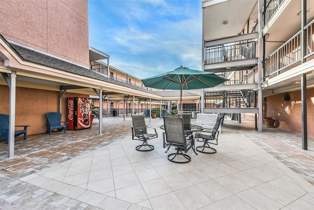 view of patio with a balcony