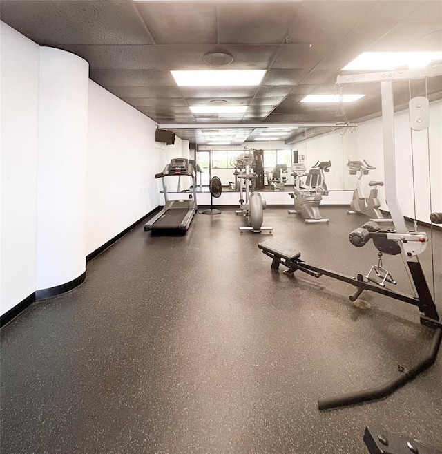 gym featuring a paneled ceiling