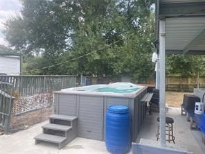 view of patio with a hot tub