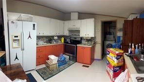 kitchen featuring white fridge with ice dispenser, tasteful backsplash, white cabinets, and stove