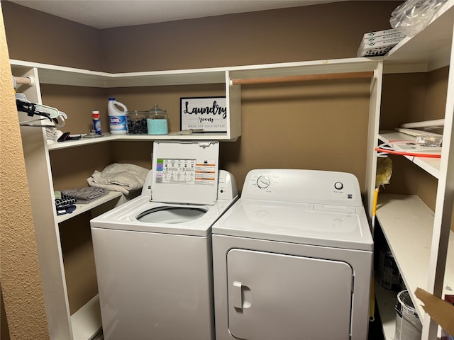 laundry room featuring washing machine and clothes dryer