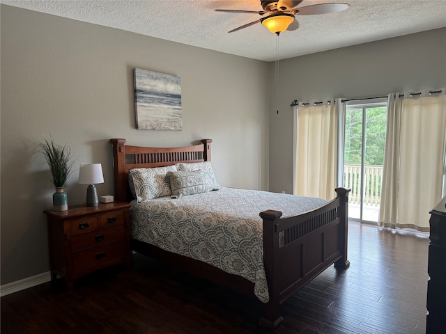 bedroom with ceiling fan, a textured ceiling, dark wood-type flooring, and access to outside