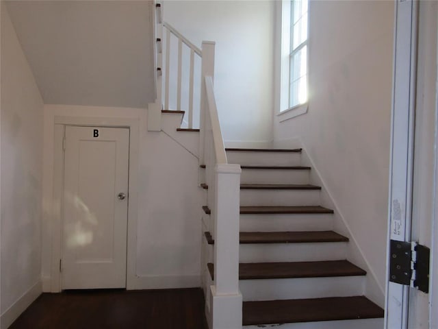 stairway featuring baseboards