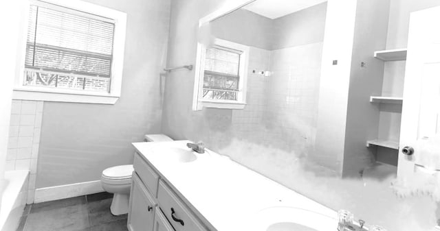 full bathroom featuring double vanity, toilet, tile flooring, and tiled shower / bath combo