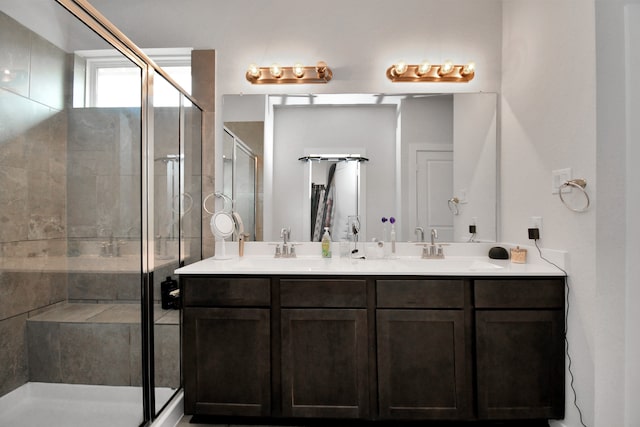 bathroom featuring vanity and a shower with shower door