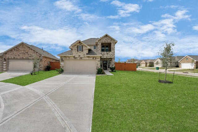 view of front facade featuring a garage and a front lawn