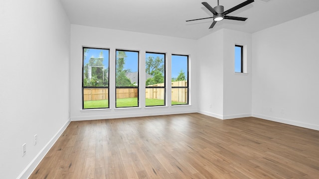 unfurnished room featuring ceiling fan and light wood-type flooring