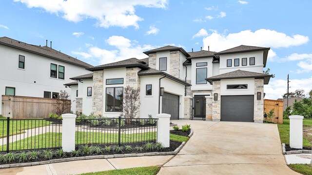 view of front facade with a front lawn and a garage