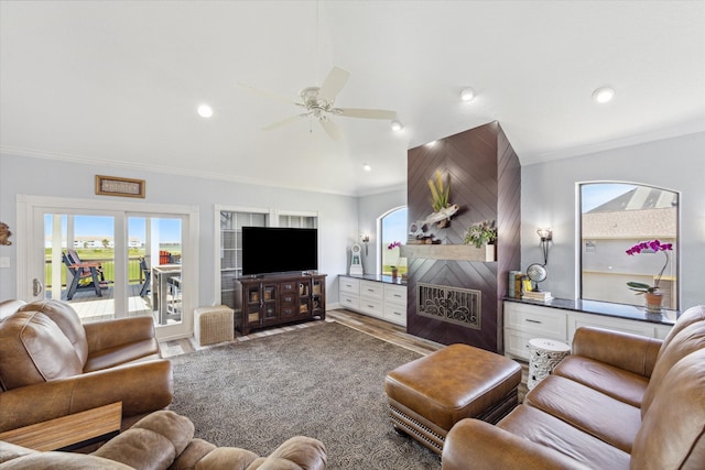 living room with ornamental molding, ceiling fan, and hardwood / wood-style flooring