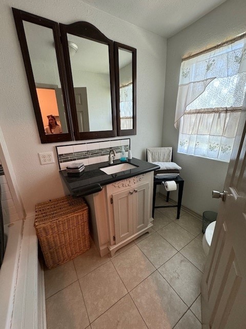 bathroom featuring tile floors and vanity