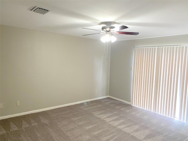 spare room with ceiling fan and carpet floors