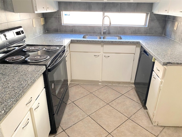 kitchen with black appliances, decorative backsplash, light tile patterned flooring, and sink