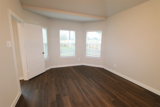 spare room with dark hardwood / wood-style floors