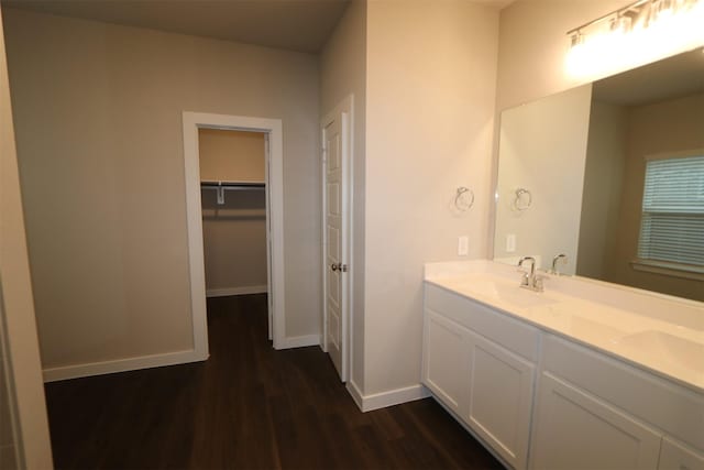 bathroom with hardwood / wood-style flooring and vanity