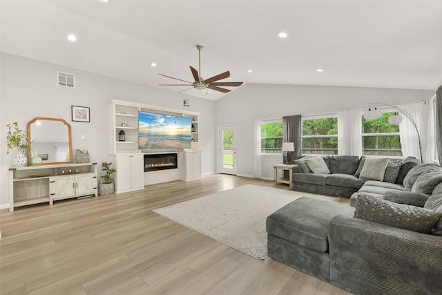 living room with vaulted ceiling, light wood-type flooring, and ceiling fan