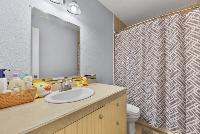 bathroom featuring vanity, toilet, and a shower with shower curtain