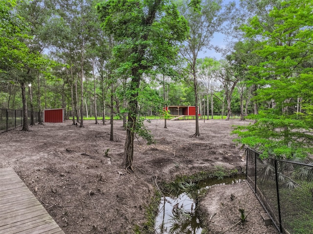 view of playground featuring an outbuilding