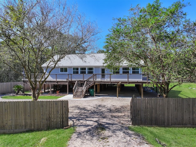 view of front facade featuring a deck and a carport