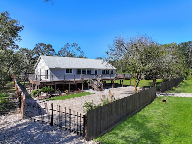 view of front of home with a front lawn and a deck