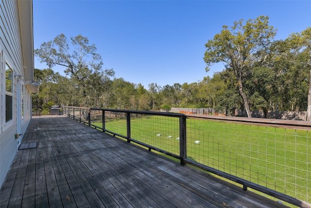 wooden terrace with a yard