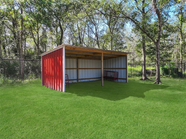 view of outdoor structure featuring a yard