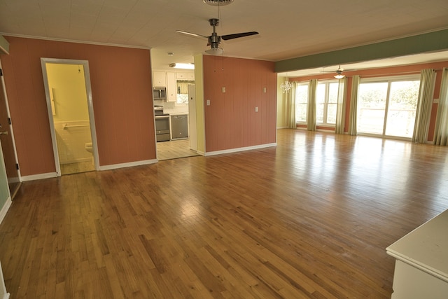 unfurnished living room featuring ornamental molding, ceiling fan, and light hardwood / wood-style floors