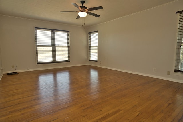 spare room featuring ornamental molding, dark hardwood / wood-style floors, and ceiling fan