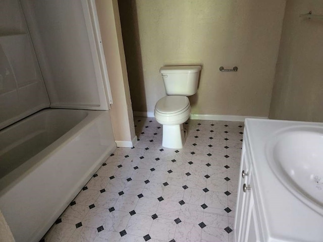 full bathroom featuring washtub / shower combination, vanity, toilet, and tile floors