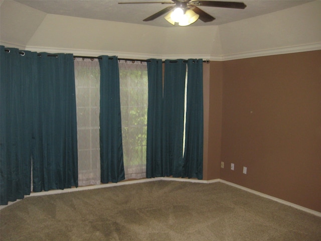 carpeted empty room featuring ceiling fan and a tray ceiling