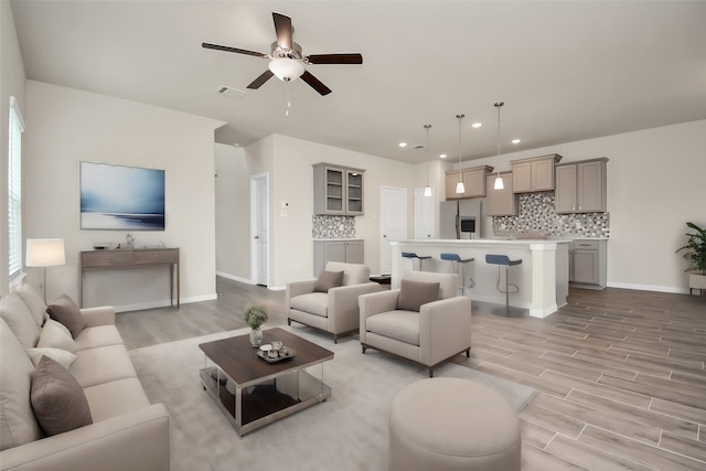 living room featuring ceiling fan