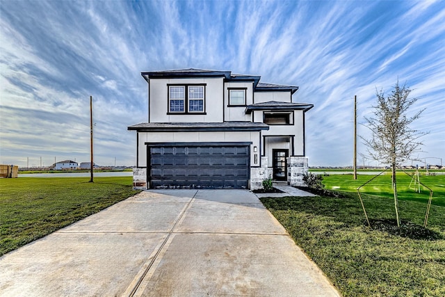 view of front of home featuring stucco siding, an attached garage, a front yard, stone siding, and driveway