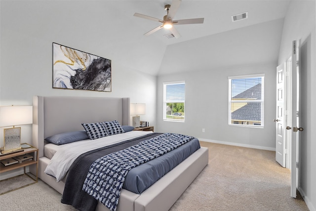 carpeted bedroom with ceiling fan and lofted ceiling