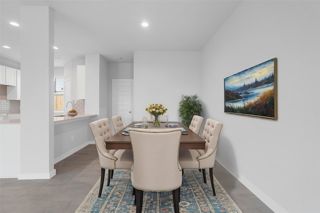 dining area featuring light wood-type flooring